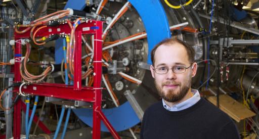 Physicist Will Fox with Magnetic Reconnection Experiment.